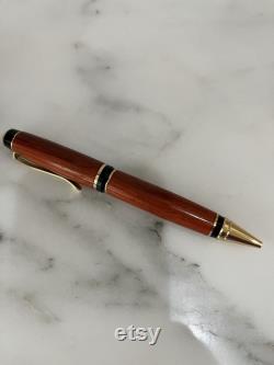 Hand crafted wooden pen in African Marbau wood. Hand turned.