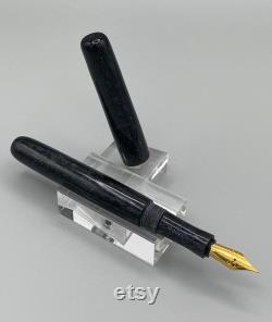 Handcrafted bespoke Fountain Pen with a body of black resin with sparkle that is like the midnight sky and is a one of a kind.