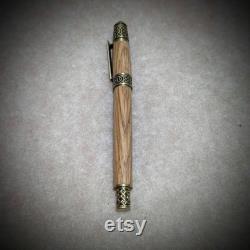 Handmade wooden fountain pen made from reclaimed Penderyn whisky barrel oak. Made with antique brass Celtic fittings.