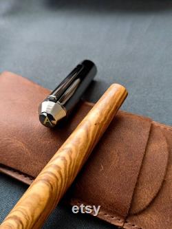 Noble filler made of olive wood and black stainless steel feather Handmade from the Allgäu